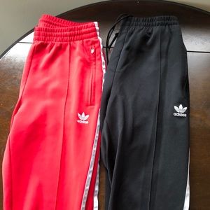 Adidas track pants with 3 stripes.